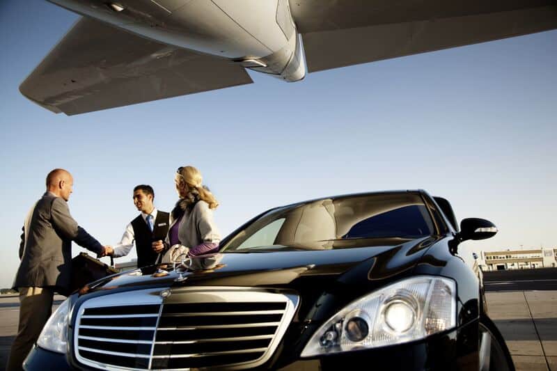 Luxury chauffeur service with black cars at Orange County airport. Professional transportation for b.